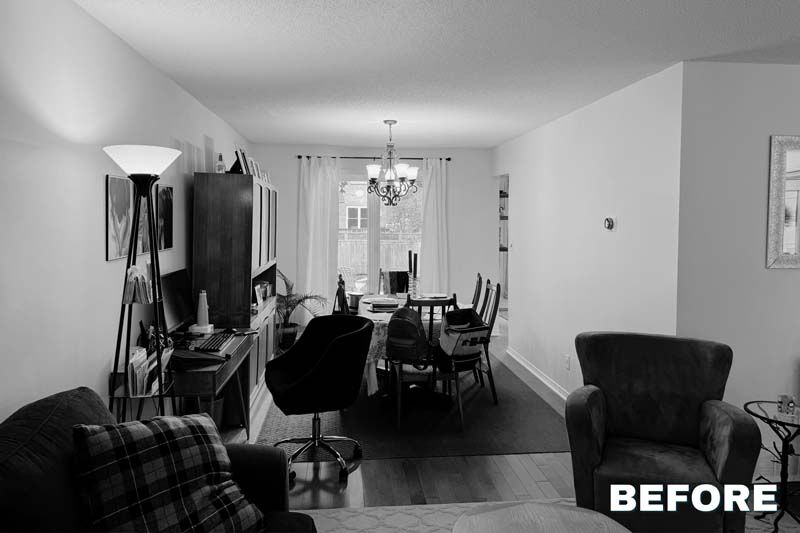 Black-and-white living room and dining area with chairs, sofa, TV, and floor lamp; “BEFORE” text in corner