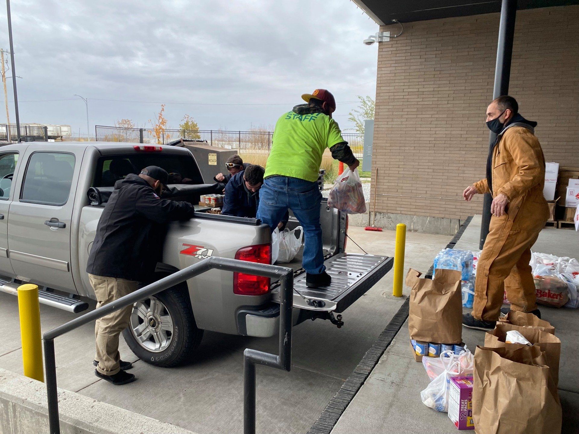 Local 16 members load donated food off truck