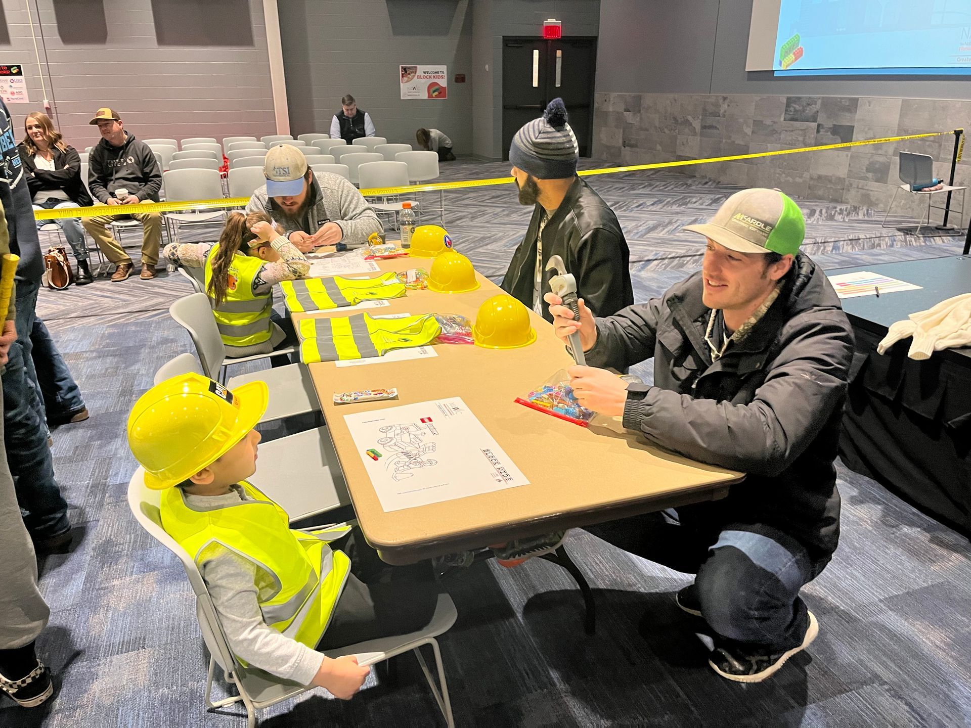 Local 16 members build legos with kids at a table