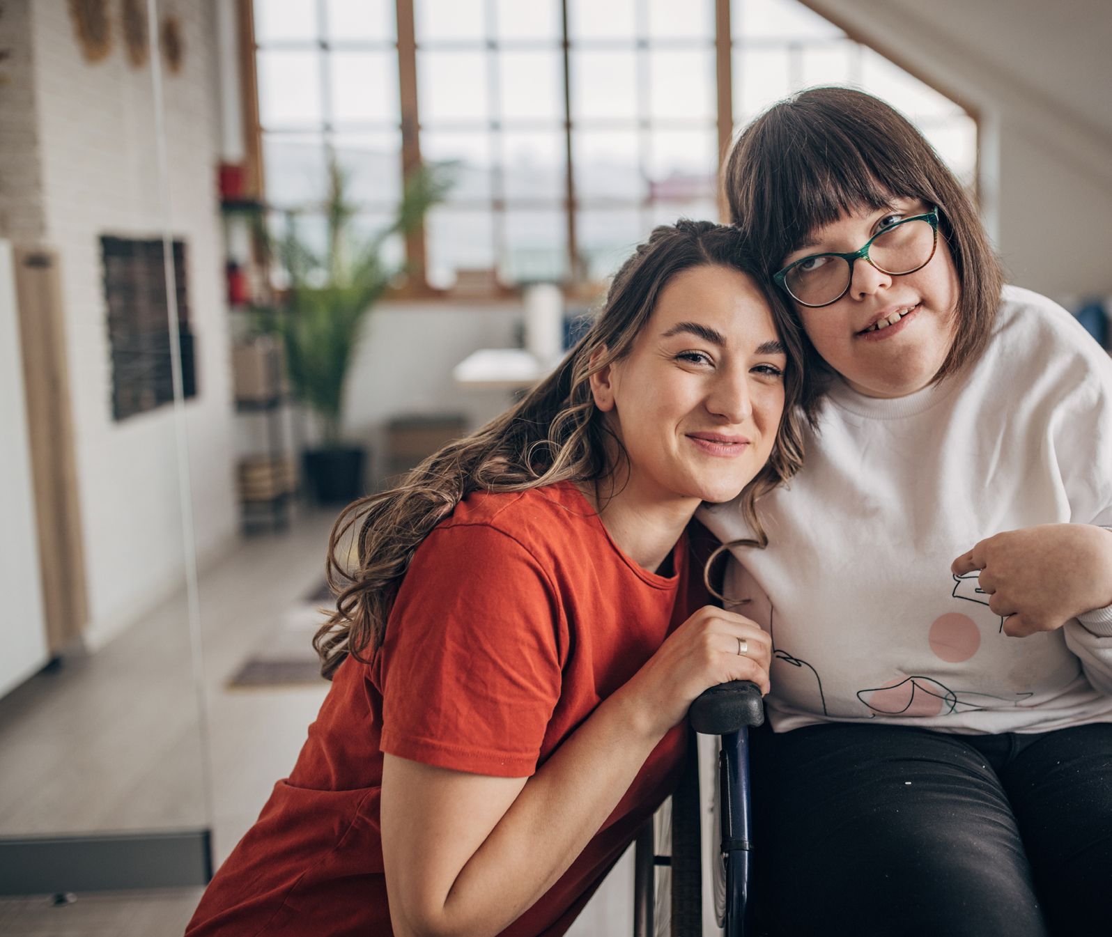 aid and girl in wheelchair