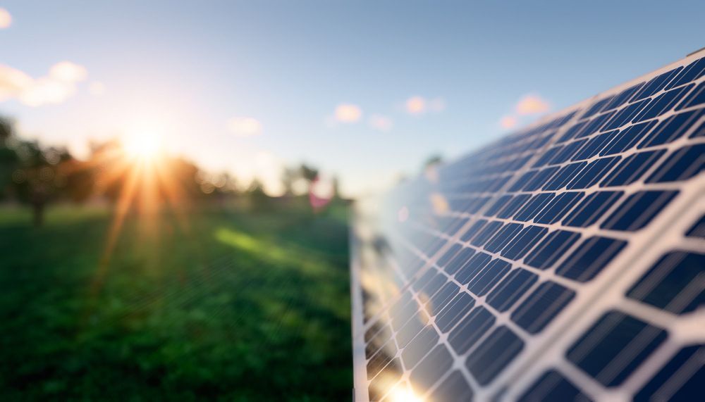 Close Up of a Solar Panel in a Field With the Sun Shining Through It — Abstract Window Cleaning in Murwillumbah, NSW