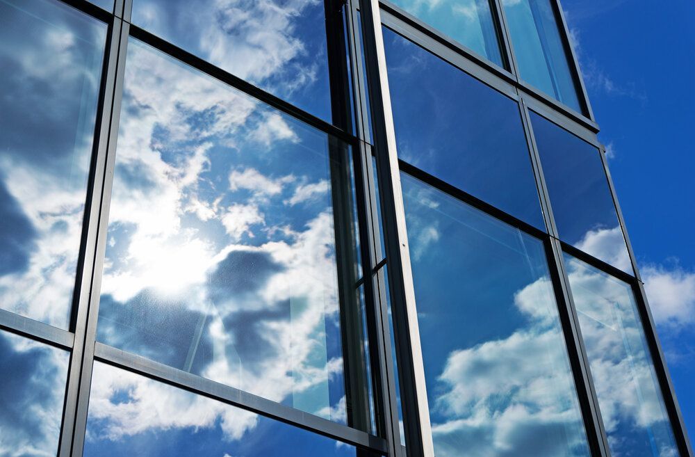 The Sky is Reflected in the Windows of a Building — Abstract Window Cleaning in Hopkins Creek, NSW