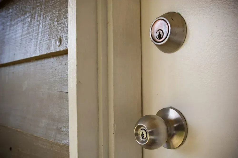 Door With a Deadbolt and Doorknob the Doorframe is Wood — Shaine Hunter Locksmiths in Doomadgee, QLD