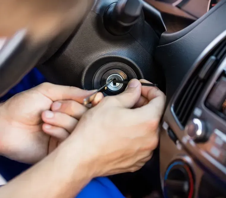 Person Using Lock Pick Tools to Open a Car's Ignition — Shaine Hunter Locksmiths in Camooweal, QLD