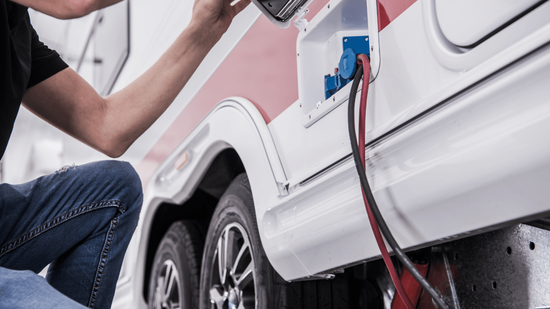 A mechanic fixing an RV roadside
