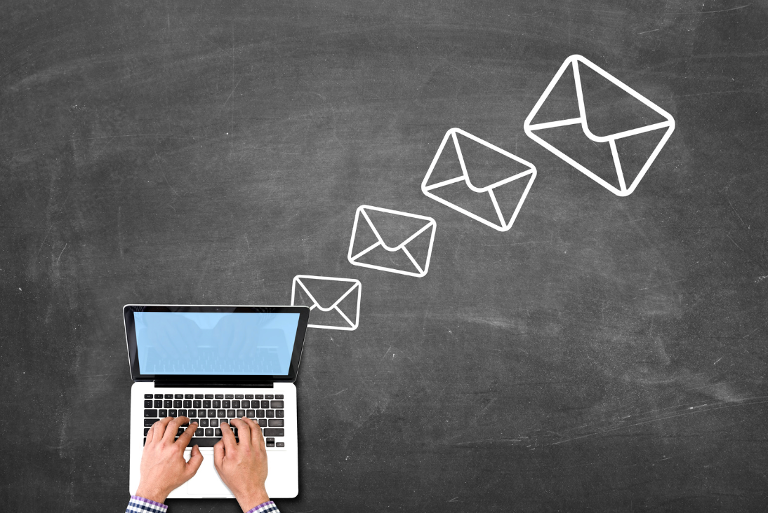animated graphic with laptop and email notifications rising up from the computer