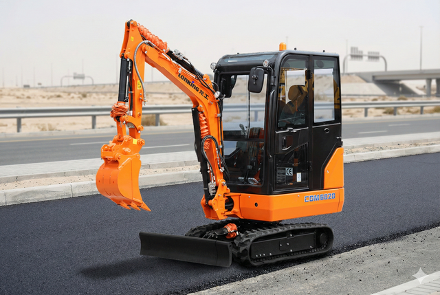 Orange and black mini excavator on asphalt road, arm extended, in a sunny setting.