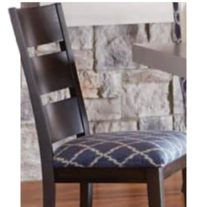 Dark wood dining chair with blue patterned cushion in front of a stone wall
