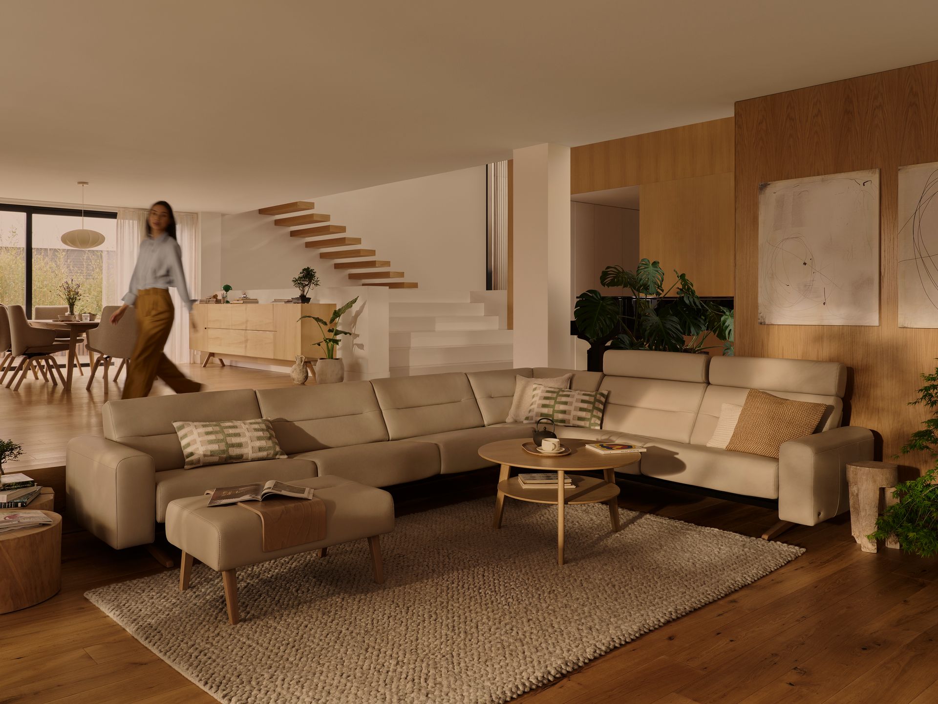 Living room with beige sofa, brown sectional, glass coffee table, and rustic side tables