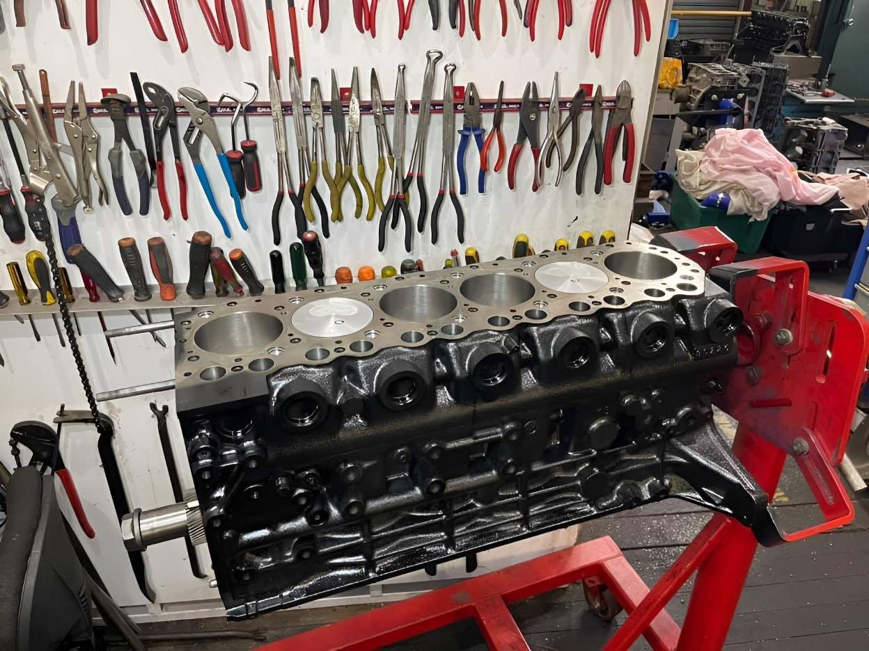 A Car Engine is Being Worked on in a Garage — Currie Bros Engine Reconditioners in Kempsey, NSW