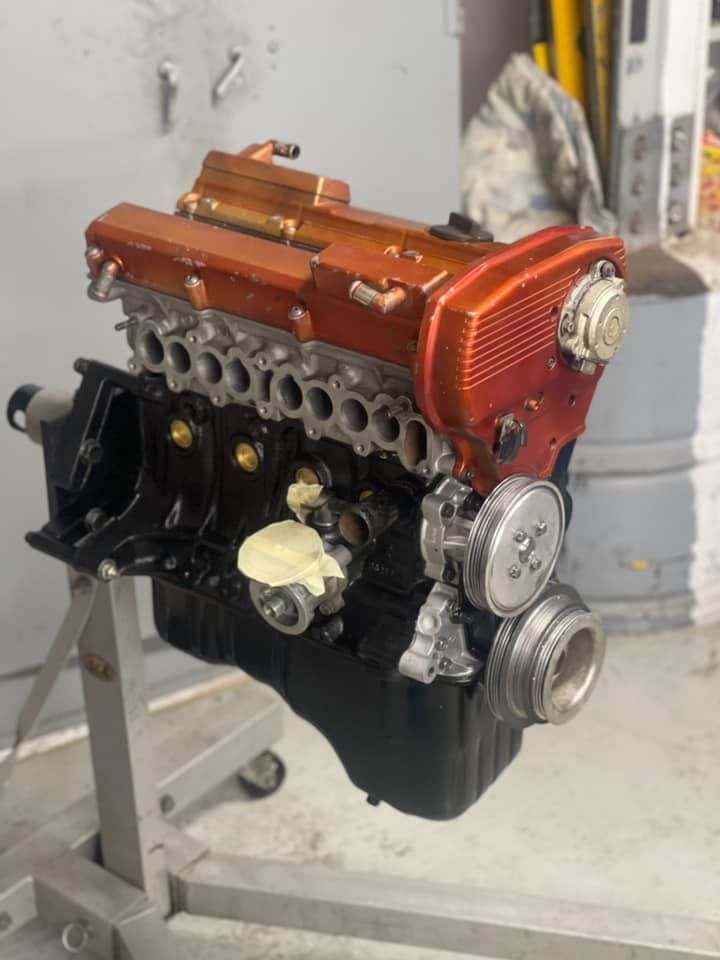 A Close Up of a Car Engine on a Stand — Currie Bros Engine Reconditioners in Taree, NSW
