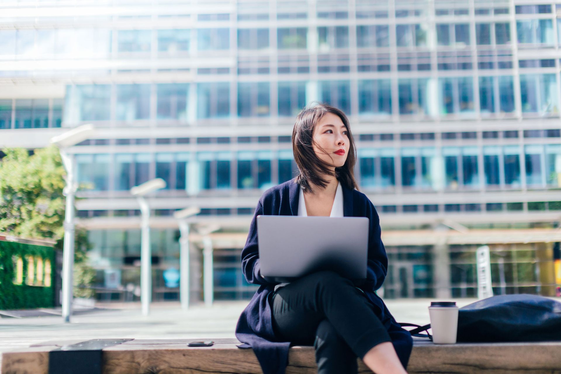 Woman Holding Laptop | Worchester, MA | Robert Powers Insurance Agency