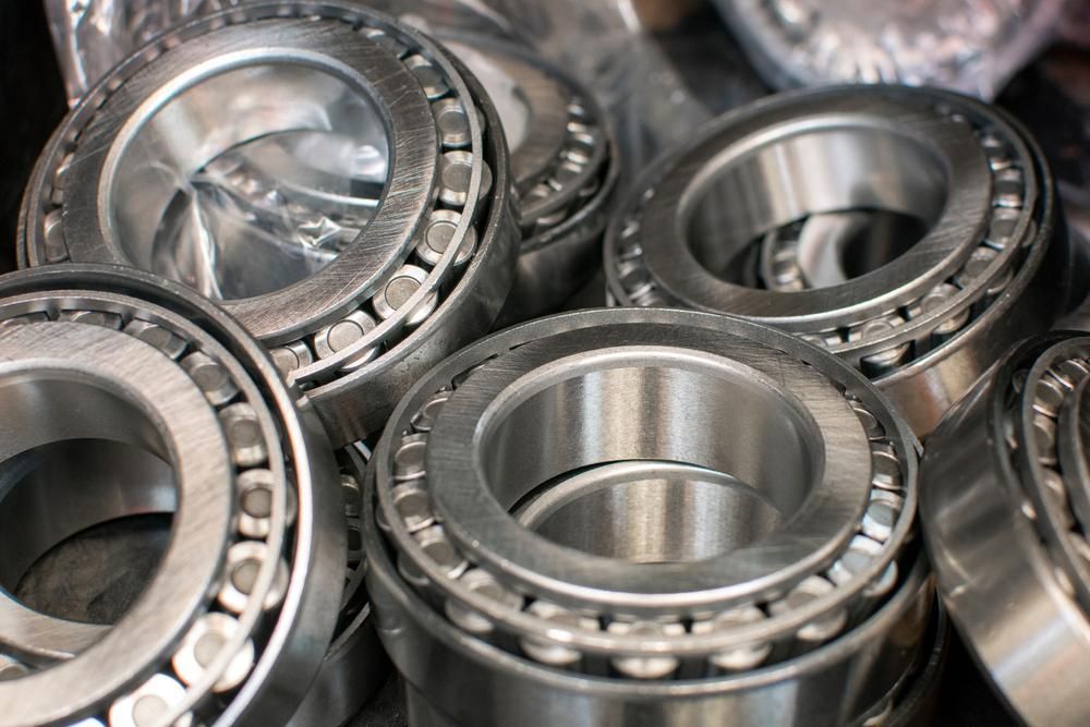 A Bunch Of Metal Bearings Are Stacked On Top Of Each Other — Cairns Caravan Repairs In Edmonton, QLD
