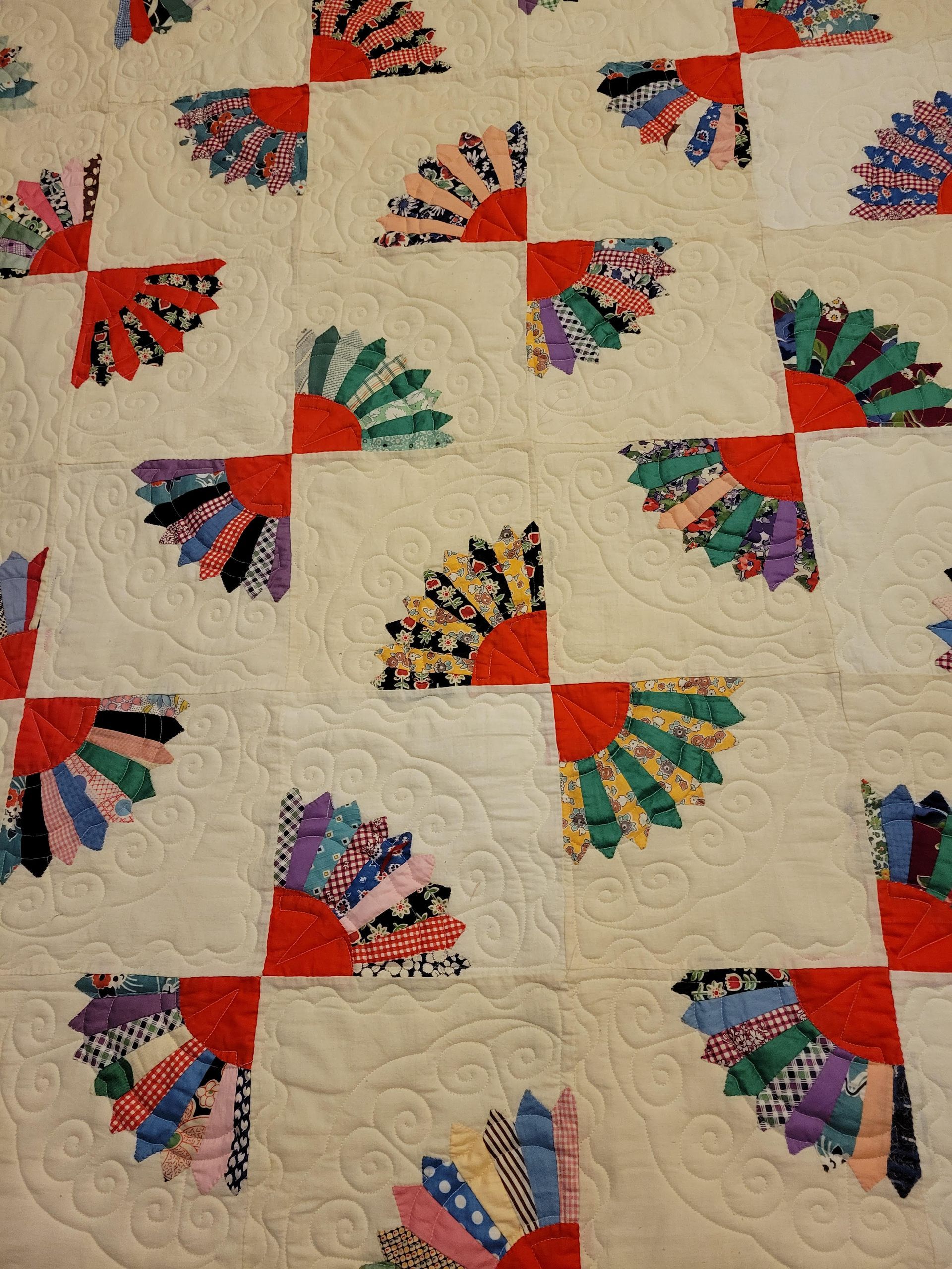 Quilt pattern cover showing a pink, blue, and white brick-style quilt titled “Brick Street” by Fabric Cafe.