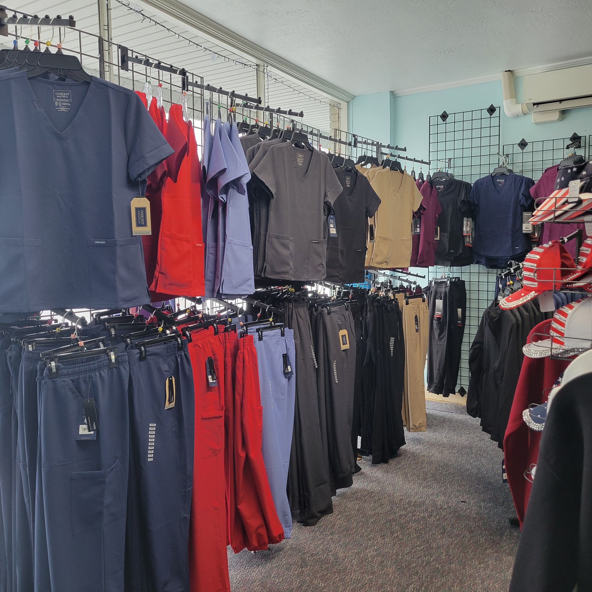 A blue jacket is hanging on a rack in a store