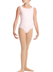 Young ballet dancer in a pale pink leotard and beige tights standing against a white background