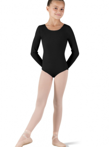 Young ballet dancer in a black leotard and pink tights standing in a pose on a white background