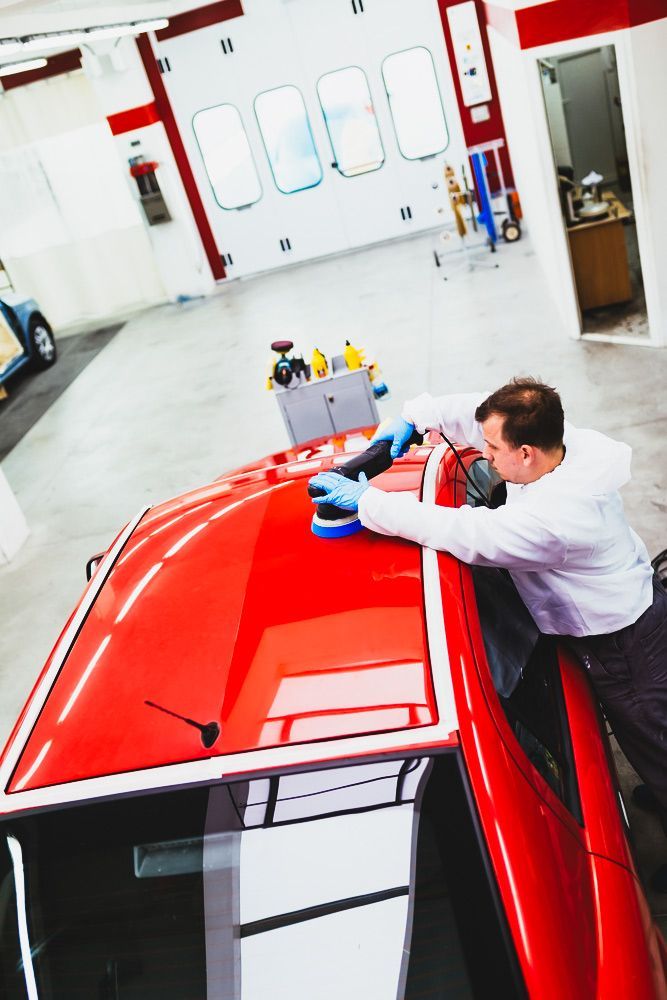Detailing The Roof Of A Classic Red Car in A Workshop — Old School Custom And Collision in Fawkner, VIC