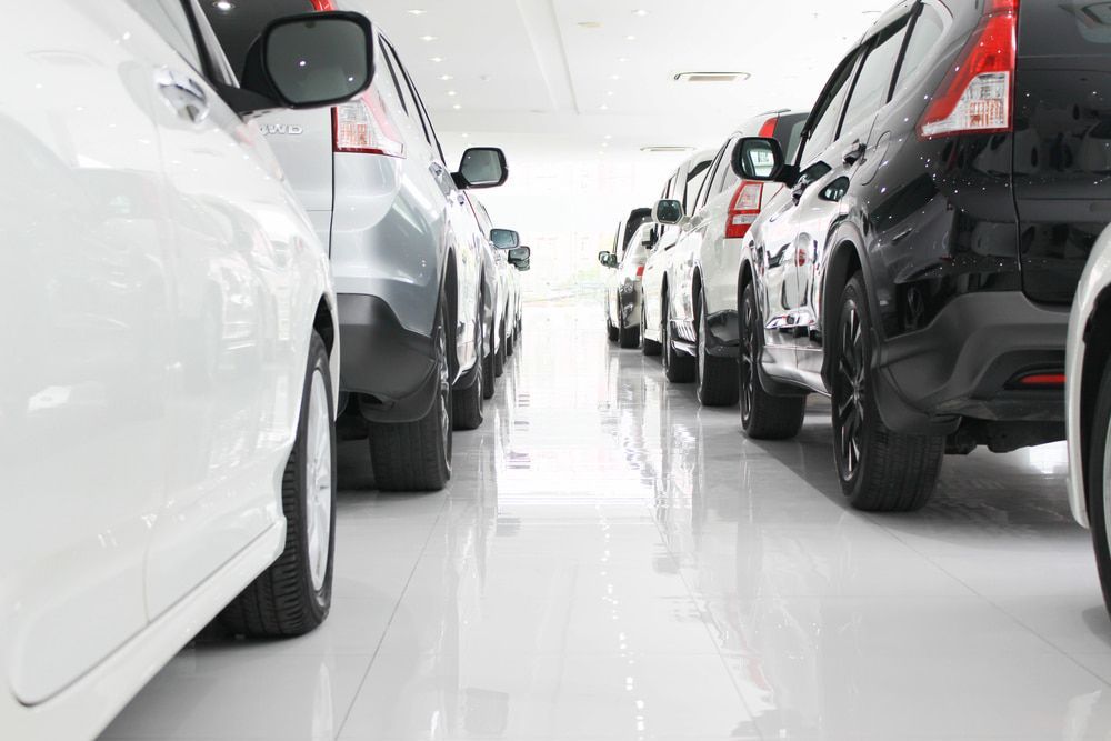 Rows of Parked Cars in A Bright Indoor Showroom — Old School Custom And Collision in Fawkner, VIC