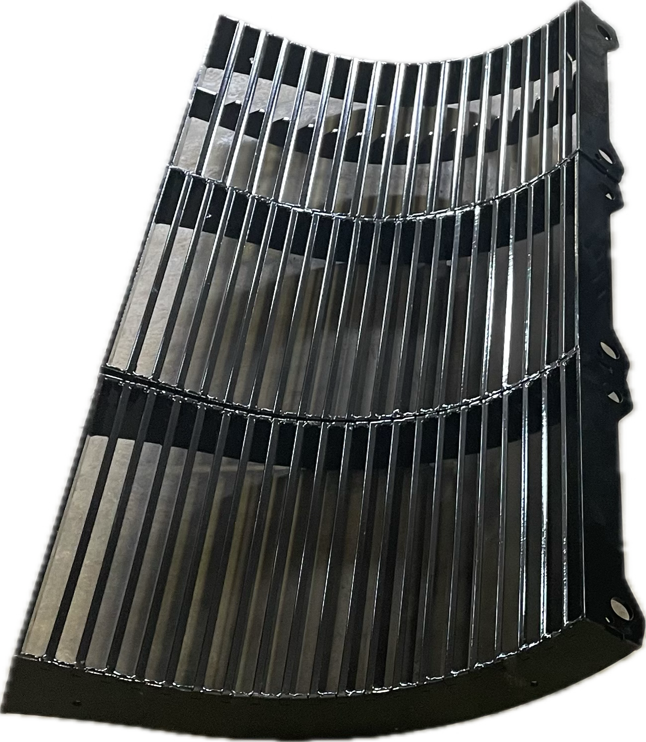 Curved metal grating with parallel bars and dark horizontal supports.