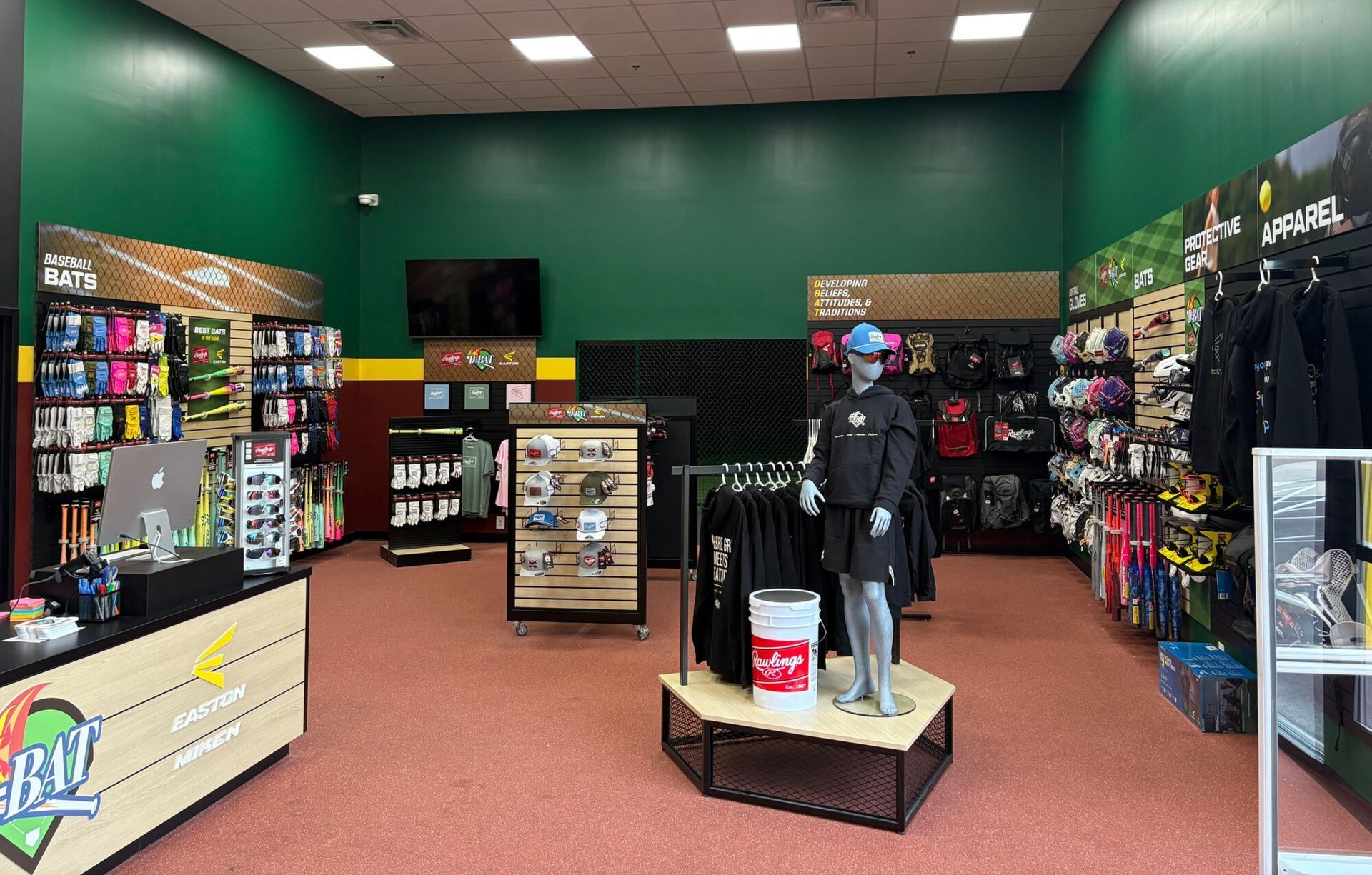 Retail store interior with shelves, display racks, and a mannequin on a central platform.