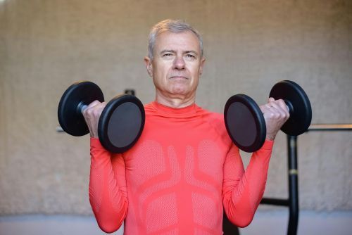 John Brown, active senior, completing dumbbell exercise