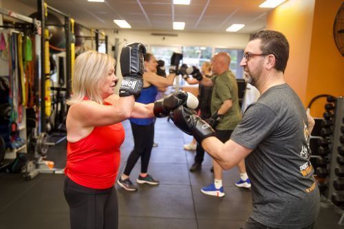 Clients completing a box blast gym workout in the Key to Life studio
