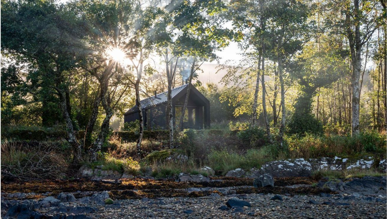 Kabn cabins surrounded by trees in the Morning.