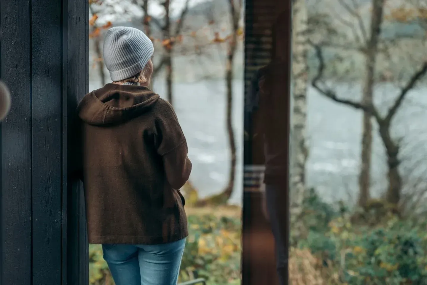 A guest looking out at a scenic loch view.