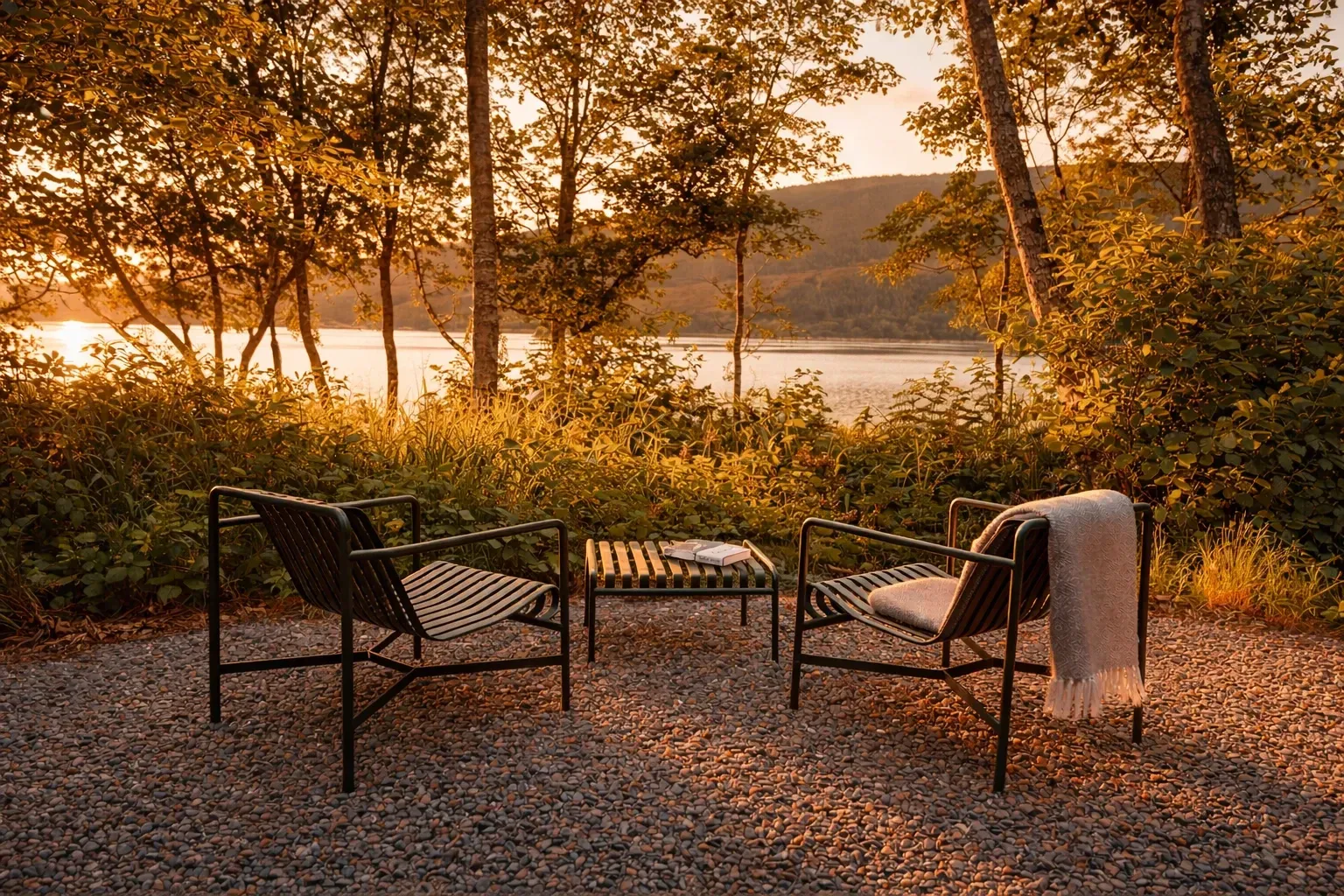 Private outdoor seating overlooking a loch at a luxury cabin in Scotland