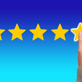 Five gold stars on blue background with a hand touching the fifth star