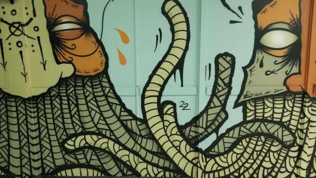 A close up of a cartoon drawing on a wall