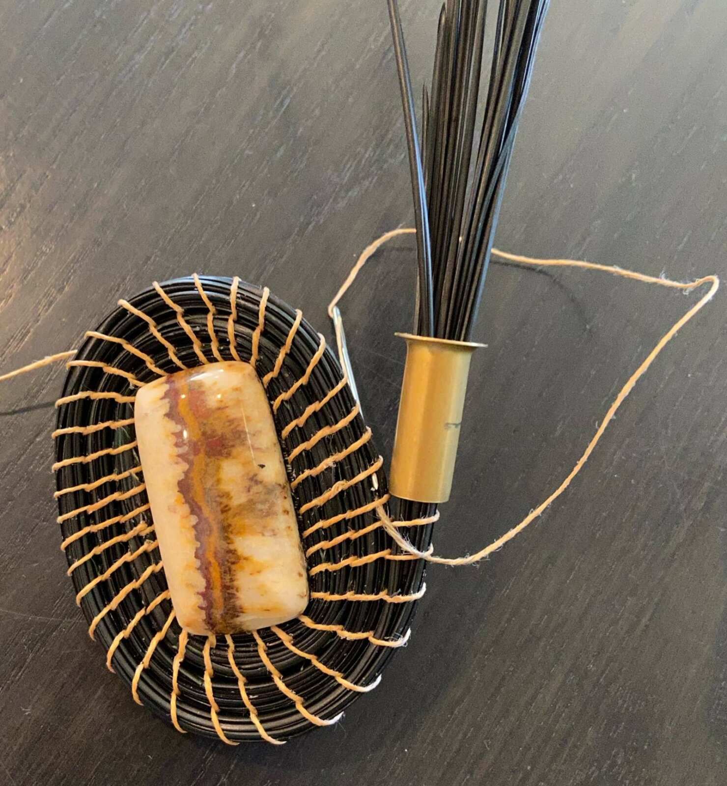 A wicker basket with a piece of wood in it