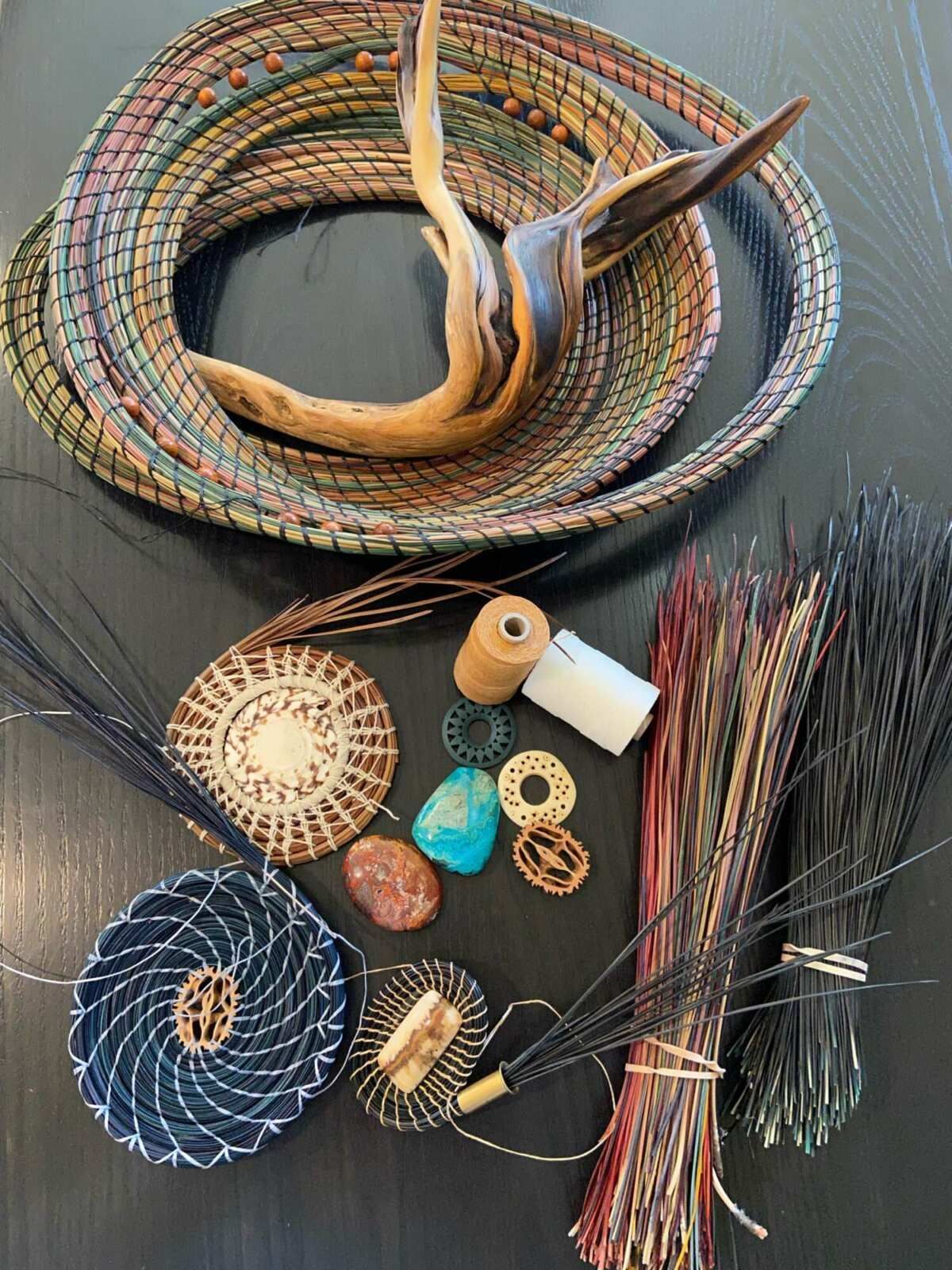 A bunch of woven items are sitting on a table.