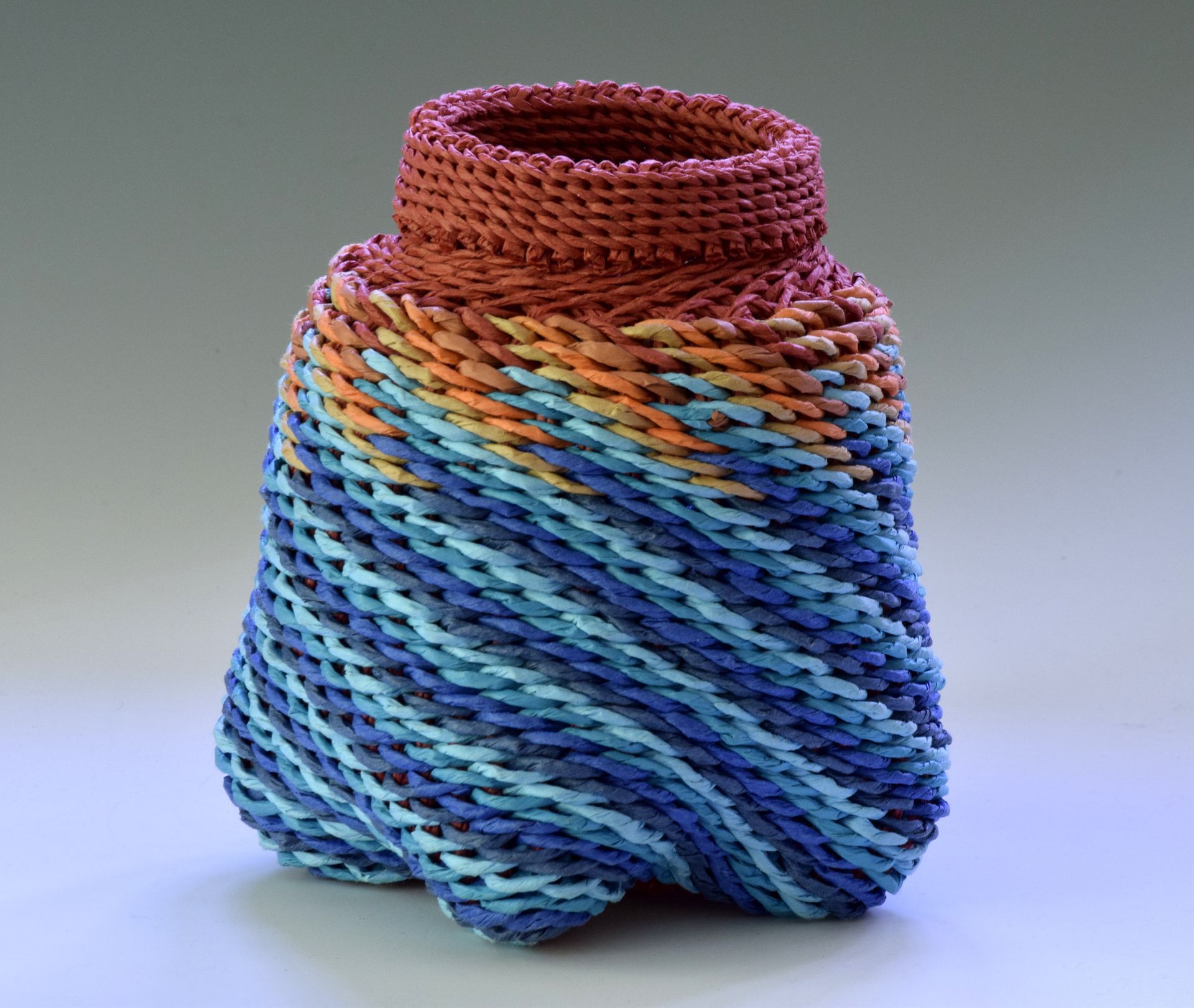 A colorful knitted object is sitting on a table