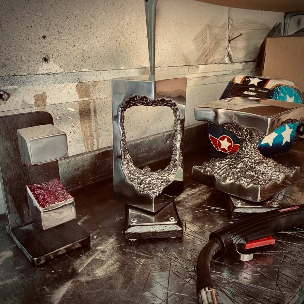 A bunch of metal sculptures are sitting on a table
