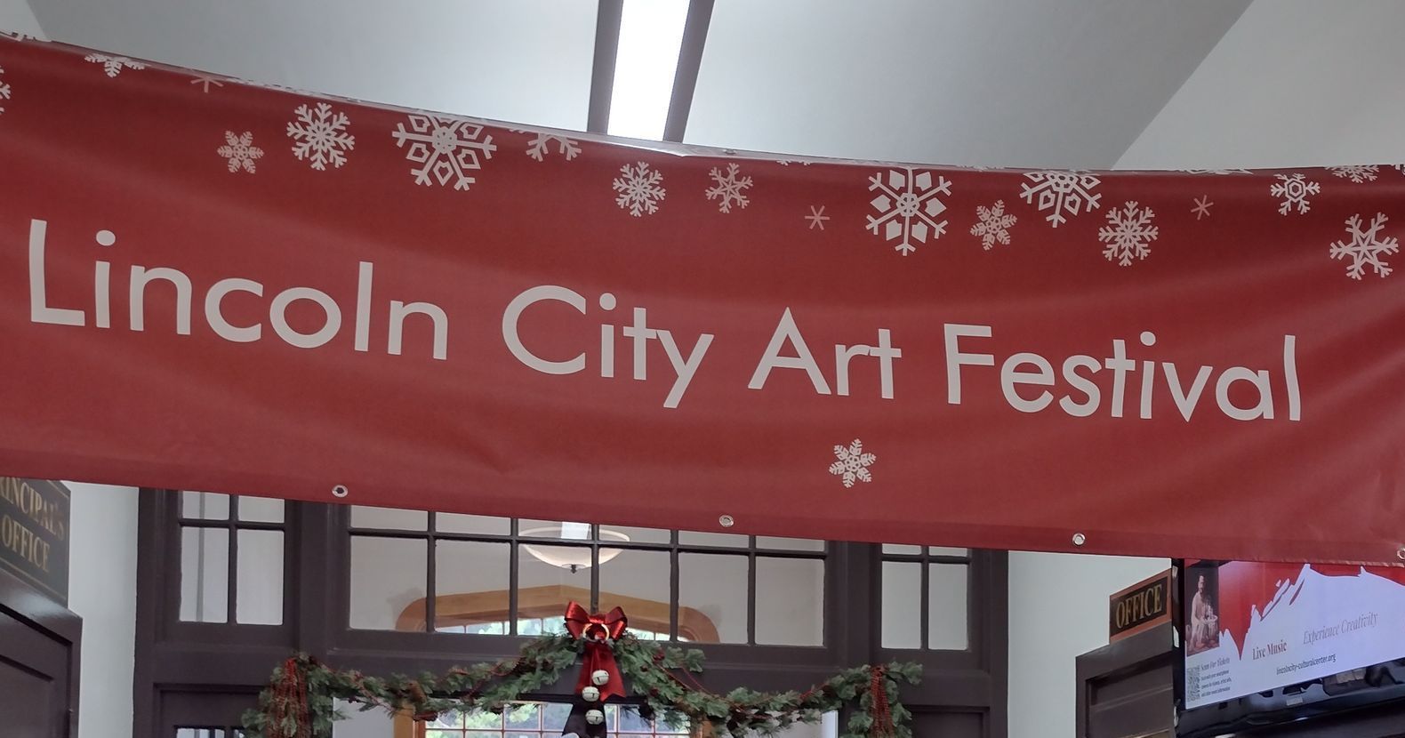 A red banner that says lincoln city art festival