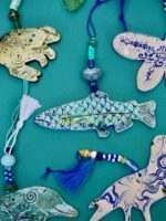 There are many different types of fish and animals on the table.