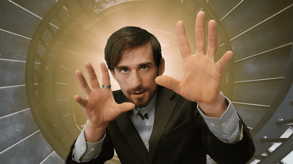 A man in a suit is making a stop sign with his hands.