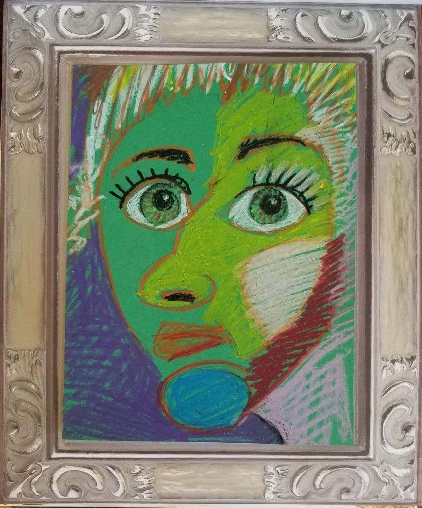 A framed painting of a woman 's face with green eyes