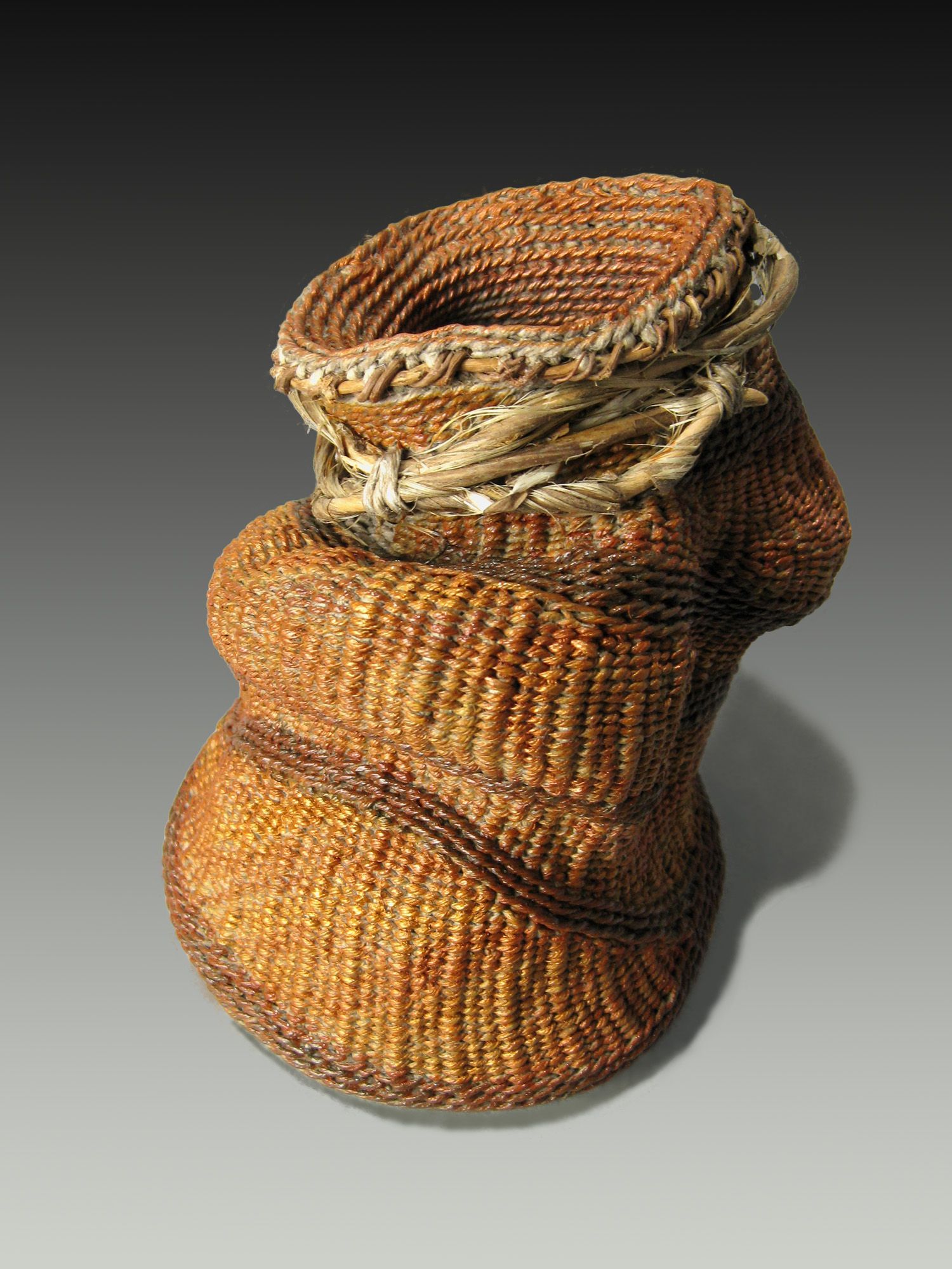 A wicker basket is sitting on a gray surface