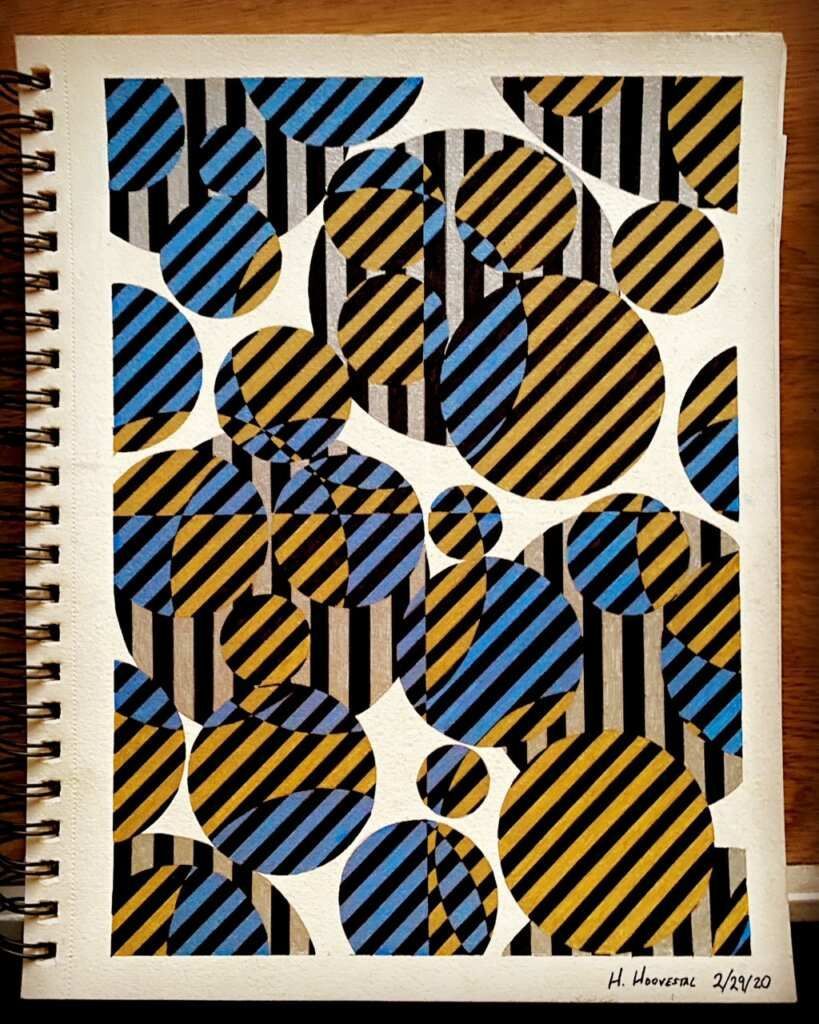 A spiral notebook with a striped pattern on it