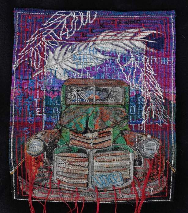 A black t-shirt with a picture of an old truck on it