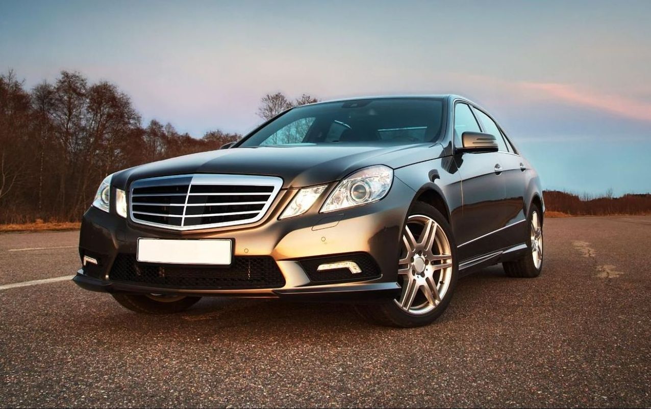 A mercedes benz is parked on the side of the road