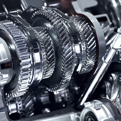 A close up of a gearbox in a car engine.