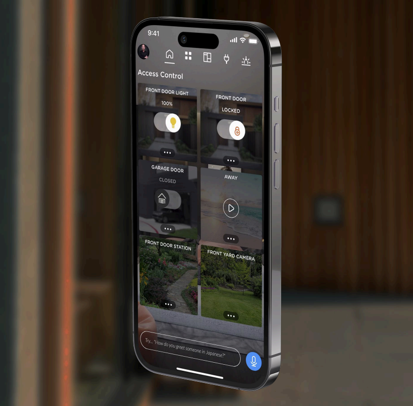 High-rise building with reflective blue glass facade, topped with flags, palm trees in front.