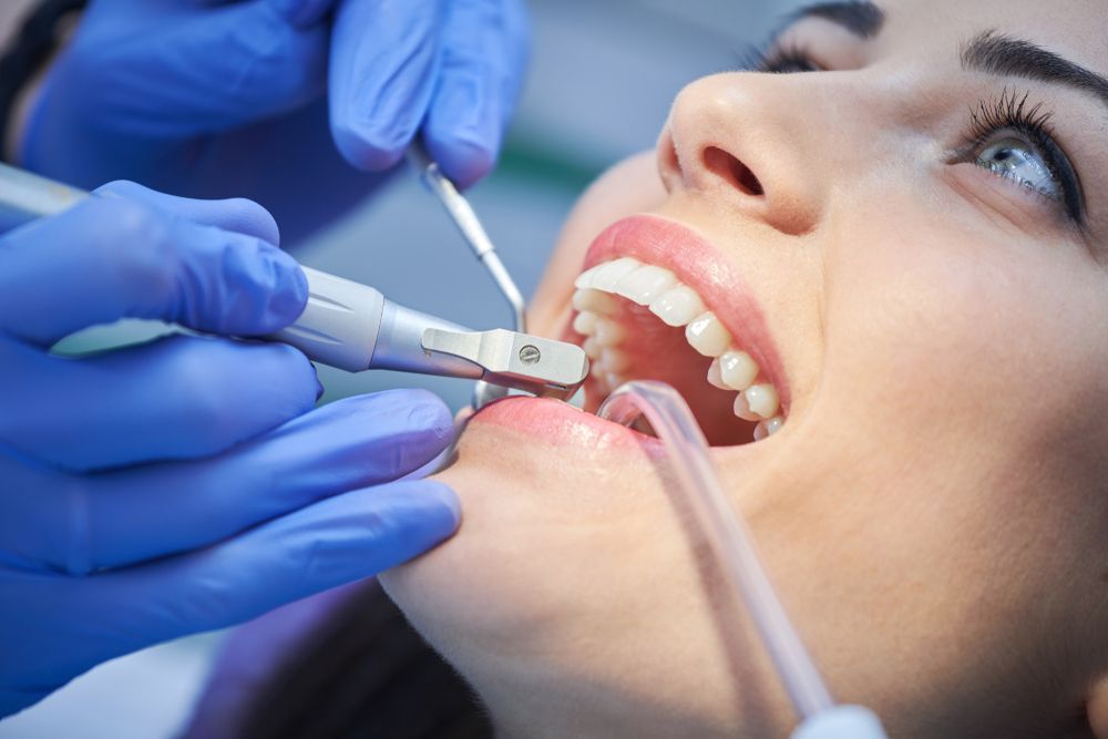 Woman in pain | Woman With A Headache | Womain Holding Cloth To Upper Lip | Discomfort and Pain in your mouth | ScarboroSmiles | Best Dentist in Scarborough