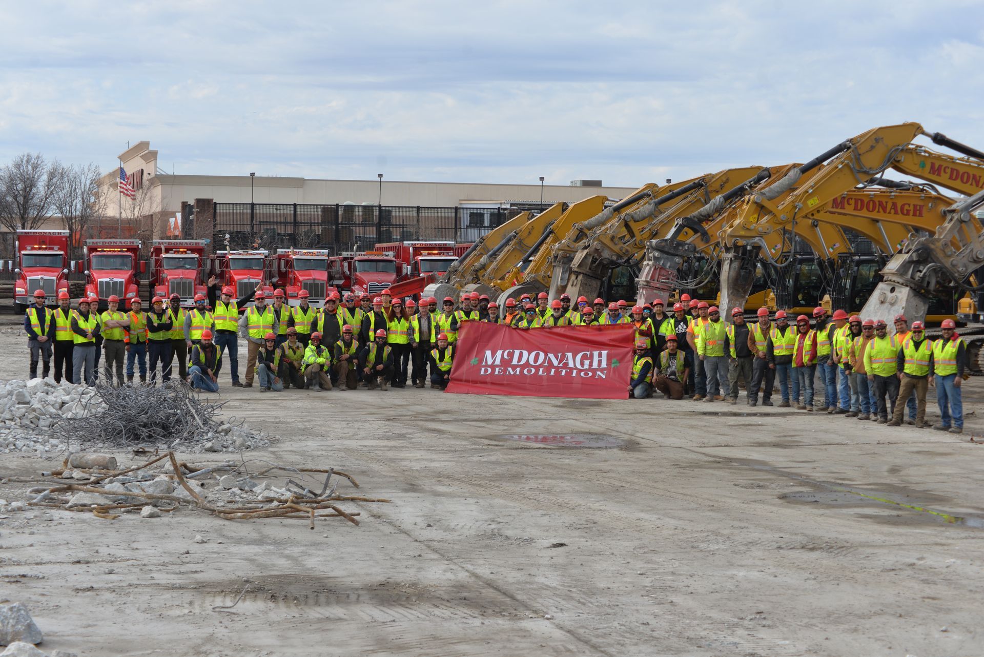 A group of construction workers are posing for a picture