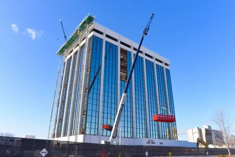 A large building with a lot of windows is being built