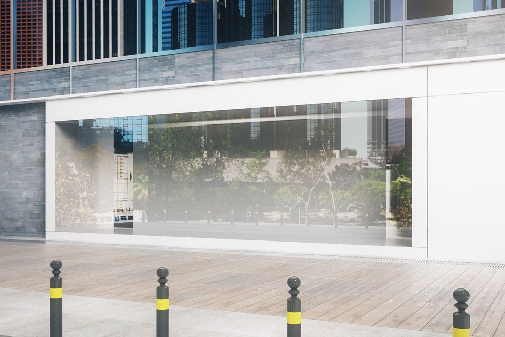 An Empty Store Front Of A Building With A Large Glass Window — Lumba Glass & Glazing In Kincumber, NSW 